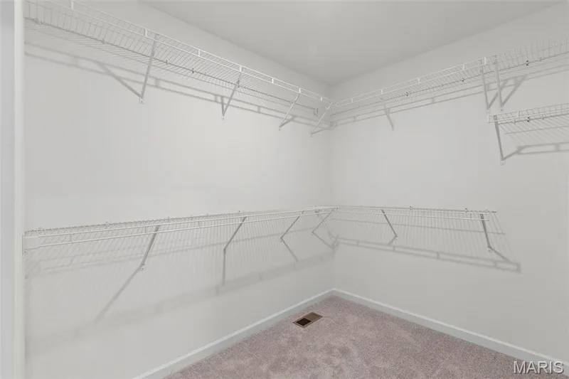 Spacious closet featuring carpet floors — 2 Maple Expanded at Harvest Est, O'Fallon, MO 63385