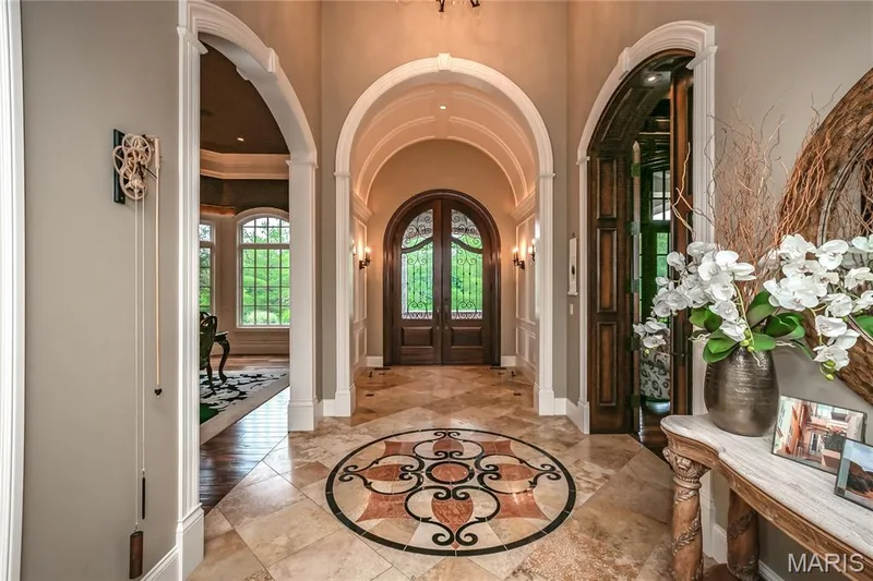 View of the Entry Foyer from the Great Room. To the left in this photo is the Formal Dining room and to the right, the Library — 4 Slate River Way, Wentzville, MO 63385