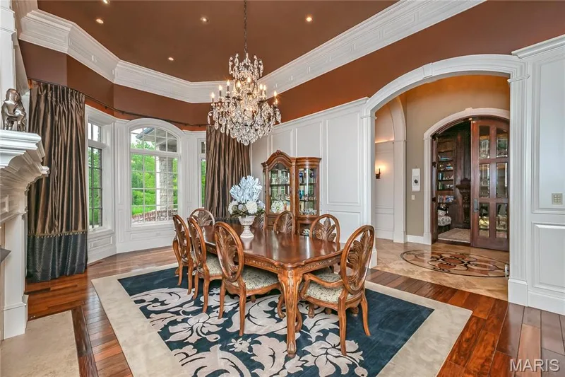 Now we move into the Formal Dining Room featuring a bay window, recessed lighting & gas fireplace — 4 Slate River Way, Wentzville, MO 63385