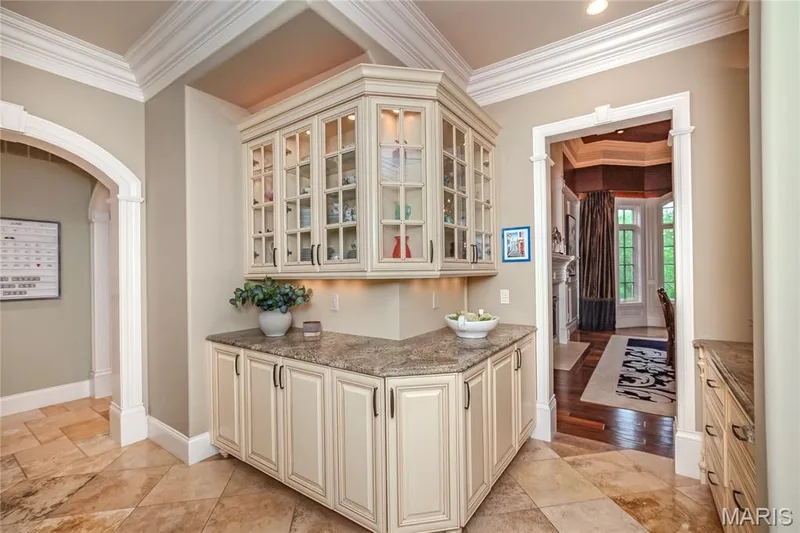Butlers Pantry; the doorway to the right leads to the Dining room while the hall to the left leads to the kitchen — 4 Slate River Way, Wentzville, MO 63385