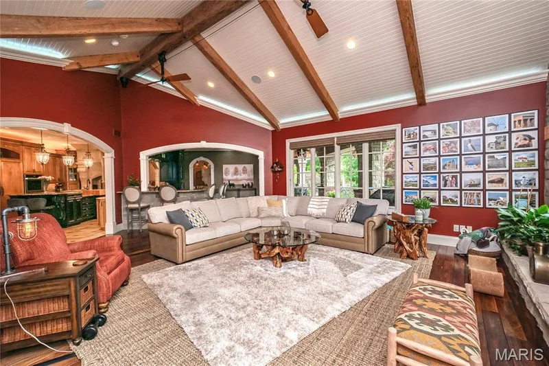 In this view of the Hearth Room, the archway to the left leads to the Kitchen/Breakfast room while the one to the right leads to the Coffee Bar room which could be any kind of bar to suite your desires — 4 Slate River Way, Wentzville, MO 63385