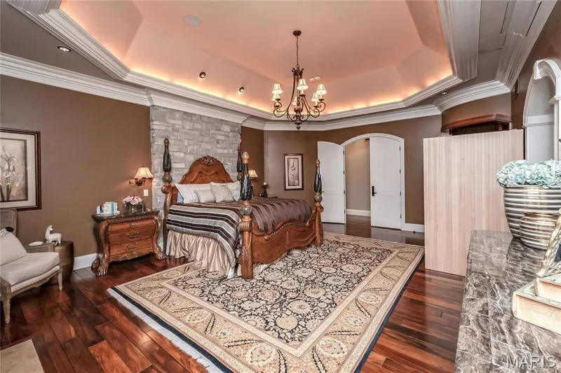 The next three photos are of the main floor master bedroom. Notice the tray ceiling, indirect & recessed lighting. — 4 Slate River Way, Wentzville, MO 63385