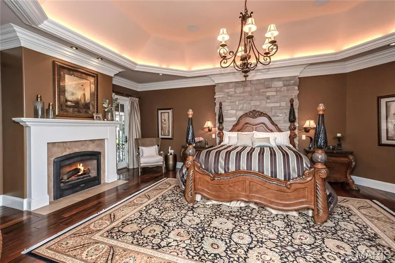 From this room you can walk out to the covered back porch directly to the hot tub as the doorway is by the gas fireplace. — 4 Slate River Way, Wentzville, MO 63385