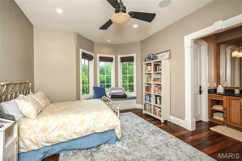 This bedroom also has a bay window seat, but what you can't see is the fiberoptic lighting in the ceiling featuring a shooting star — 4 Slate River Way, Wentzville, MO 63385