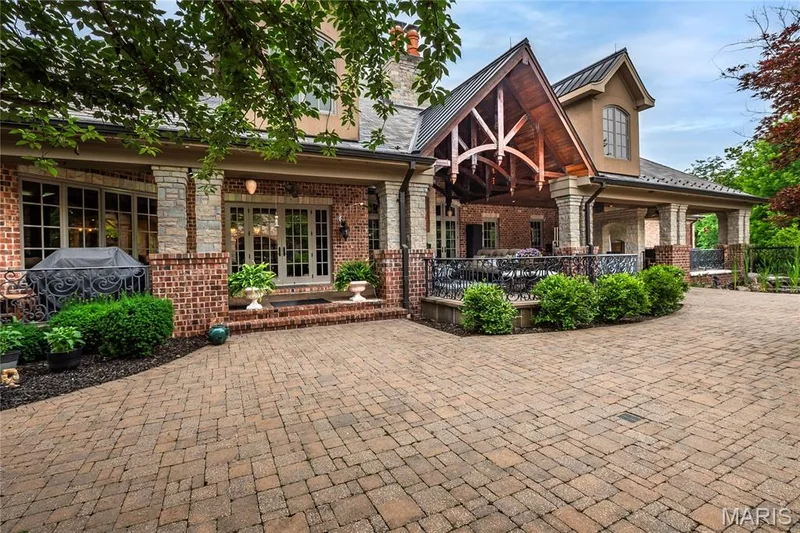 Beginning with this photo let's take a walk around the covered back porch, patio & swimming pool area — 4 Slate River Way, Wentzville, MO 63385