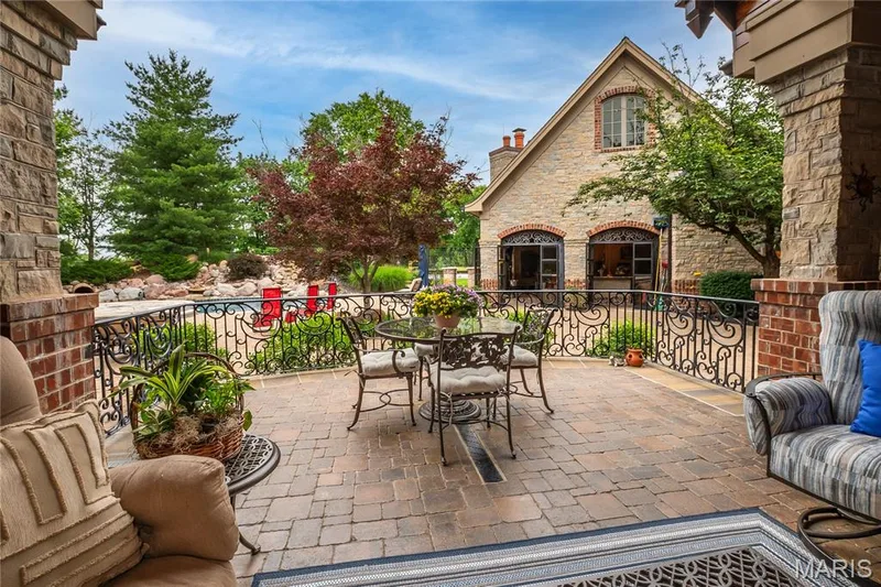 The next several photos are of the patio, pool house & swimming pool which has a slide and 2 waterfalls — 4 Slate River Way, Wentzville, MO 63385