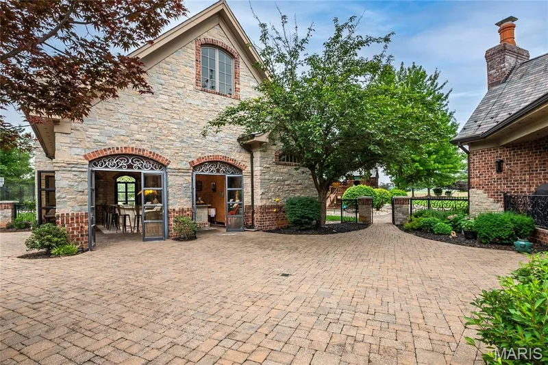 Exterior of the pool house as seen from the main house — 4 Slate River Way, Wentzville, MO 63385