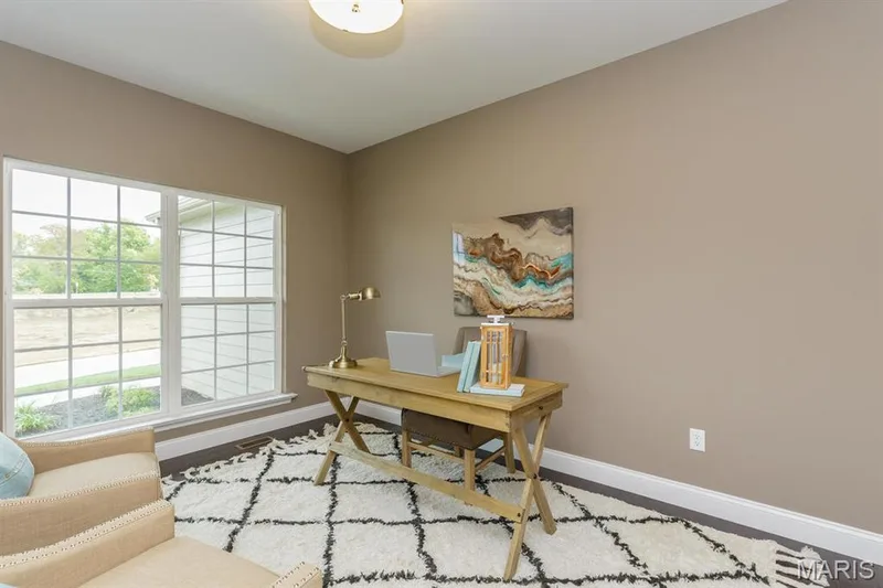 Photo representation of a similar home. Some features shown may be optional.  This room is shown as a den but can be a third bedroom. — Durham II @ Persimmon Trace, Weldon Spring, MO 63304