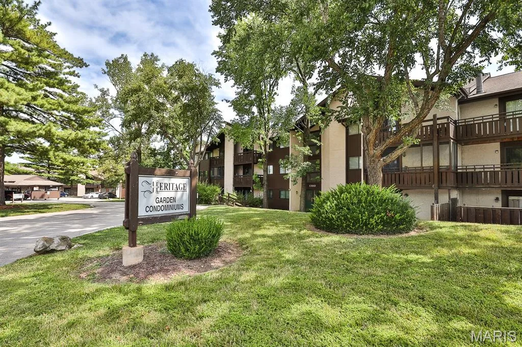 View of community with a lawn and a residential view — 1380 Heritage Landing #206, St Charles, MO 63303