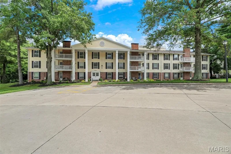 View of building exterior with uncovered parking — 1511 Hampton Hall Drive #19 & 20, Chesterfield, MO 63017
