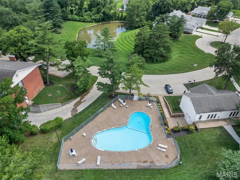 Aerial overview of property's location featuring a nearby body of water and a pool — 1511 Hampton Hall Drive #19 & 20, Chesterfield, MO 63017