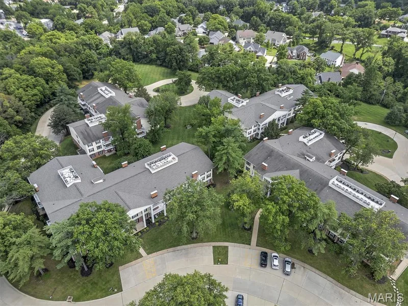 Aerial view of residential area with a tree filled landscape — 1511 Hampton Hall Drive #19 & 20, Chesterfield, MO 63017