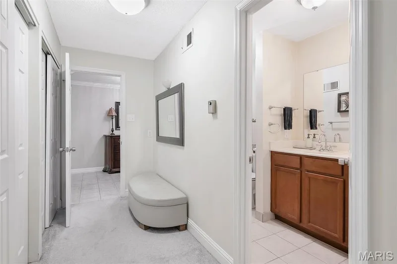Hallway featuring light tile patterned flooring — 1511 Hampton Hall Drive #19 & 20, Chesterfield, MO 63017
