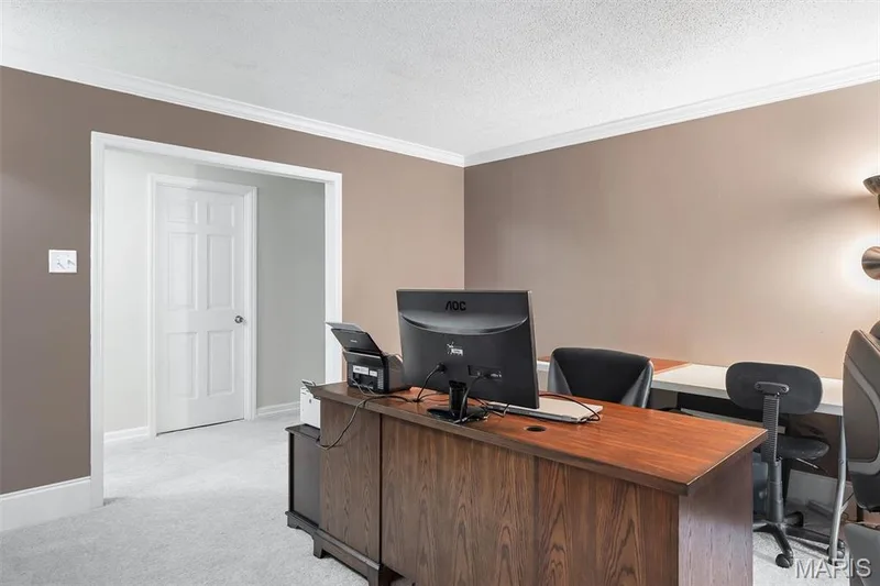 Home office with light colored carpet, ornamental molding, and a textured ceiling — 1511 Hampton Hall Drive #19 & 20, Chesterfield, MO 63017