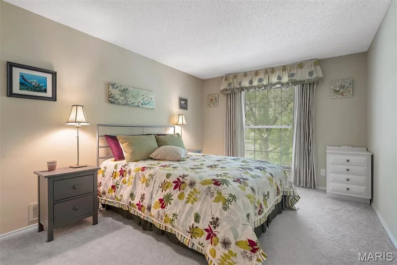 Carpeted bedroom with a textured ceiling and baseboards — 1511 Hampton Hall Drive #19 & 20, Chesterfield, MO 63017