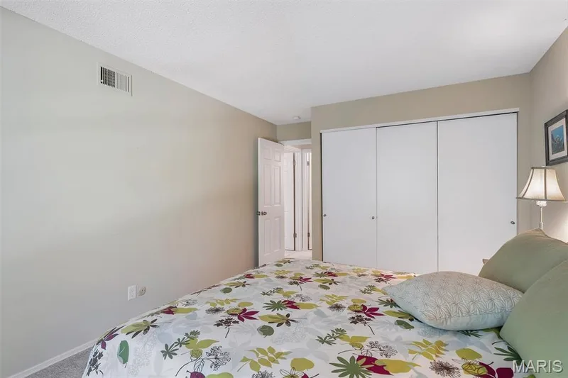 Carpeted bedroom with a closet — 1511 Hampton Hall Drive #19 & 20, Chesterfield, MO 63017