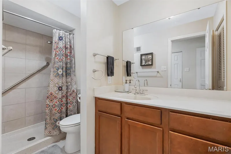 Bathroom featuring vanity and tiled shower — 1511 Hampton Hall Drive #19 & 20, Chesterfield, MO 63017