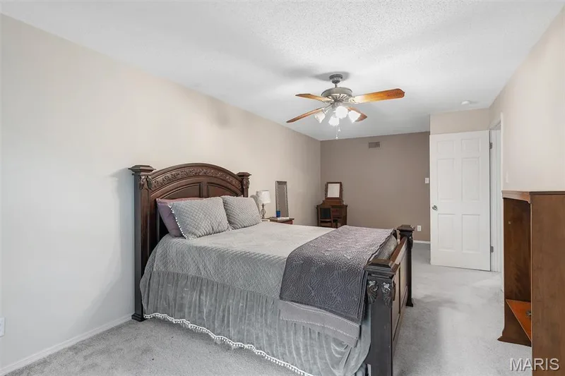 Bedroom featuring carpet and ceiling fan — 1511 Hampton Hall Drive #19 & 20, Chesterfield, MO 63017