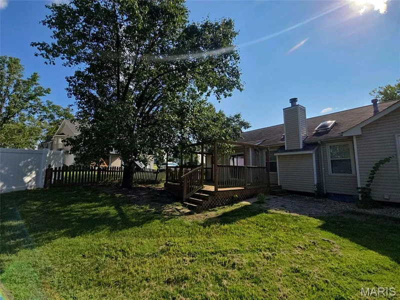 View of yard with a wooden deck — 1218 Saddlemaker Drive, St Charles, MO 63304