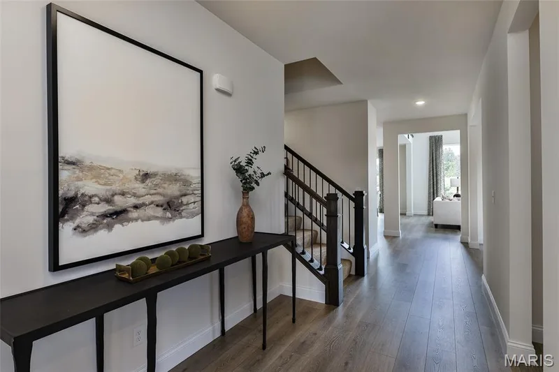 Corridor featuring wood finished floors, stairway, and recessed lighting — 0 Braxton @ Montage at Hawk Ridge, Lake St. Louis, MO 63367