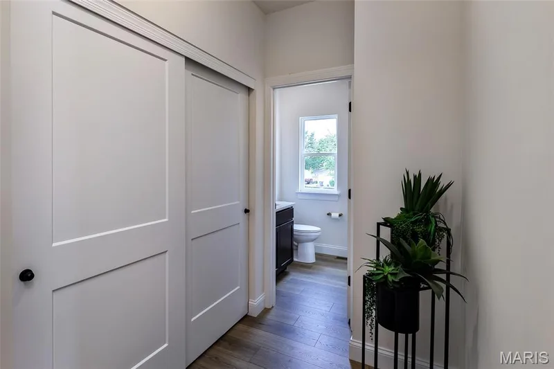 Hallway with dark wood-style floors and baseboards — 0 Braxton @ Montage at Hawk Ridge, Lake St. Louis, MO 63367