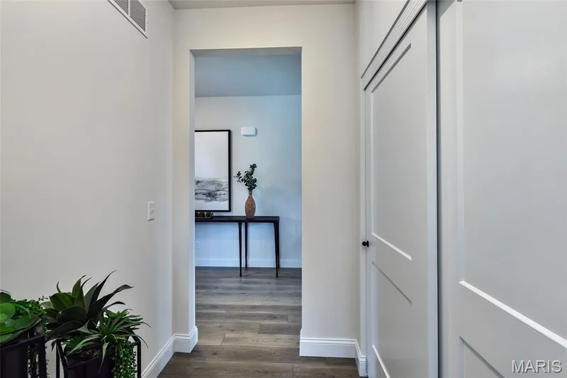 Corridor featuring dark wood-style floors and baseboards — 0 Braxton @ Montage at Hawk Ridge, Lake St. Louis, MO 63367