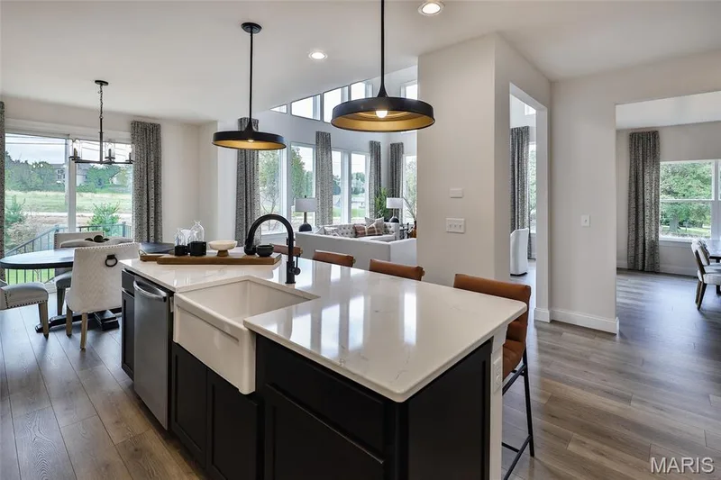 Kitchen featuring dark cabinetry, a breakfast bar area, decorative light fixtures, and recessed lighting — 0 Braxton @ Montage at Hawk Ridge, Lake St. Louis, MO 63367