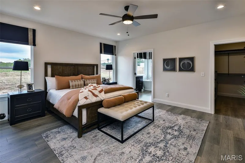 Bedroom with recessed lighting, a walk in closet, ensuite bath, ceiling fan, and dark wood finished floors — 0 Braxton @ Montage at Hawk Ridge, Lake St. Louis, MO 63367
