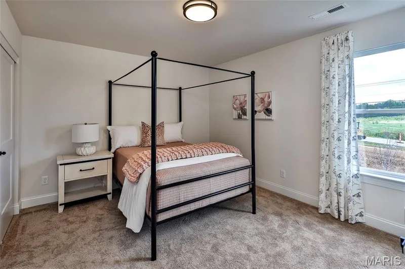 Bedroom with light carpet and baseboards — 0 Braxton @ Montage at Hawk Ridge, Lake St. Louis, MO 63367