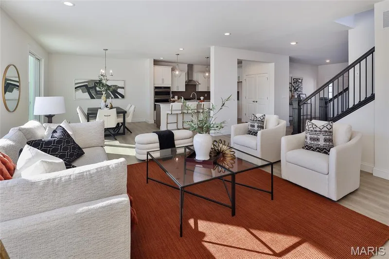 Living area featuring recessed lighting, stairway, light wood-style floors, and a chandelier — 0 Bridgeport - Montage at Hawk Ridge, Lake St. Louis, MO 63367