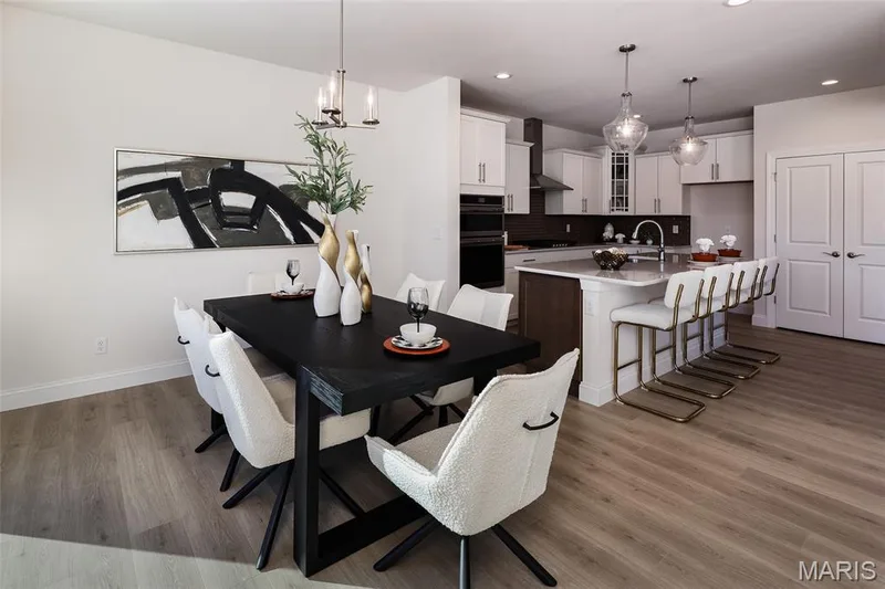 Dining space featuring light wood-style floors, a chandelier, and recessed lighting — 0 Bridgeport - Montage at Hawk Ridge, Lake St. Louis, MO 63367