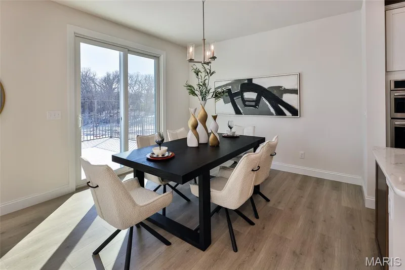 Dining room with light wood-style flooring and a chandelier — 0 Bridgeport - Montage at Hawk Ridge, Lake St. Louis, MO 63367