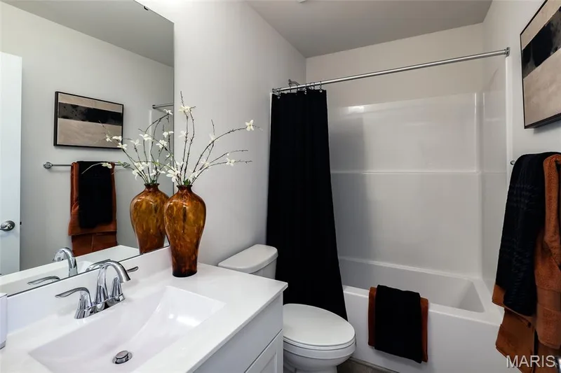Bathroom with shower / tub combo and vanity — 0 Bridgeport - Montage at Hawk Ridge, Lake St. Louis, MO 63367