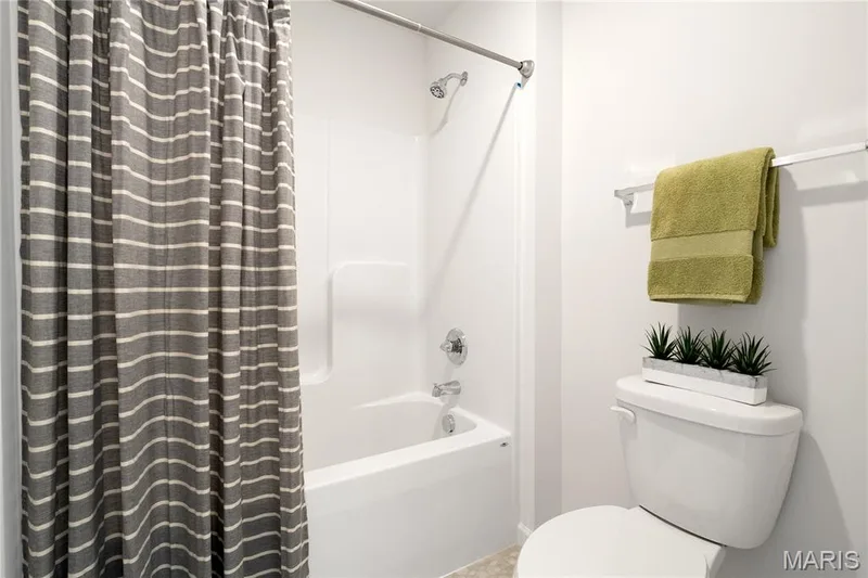 Full bathroom featuring shower / bath combo and toilet — 0 Chesapeake @ Montage at Hawk Ridge, Lake St. Louis, MO 63367