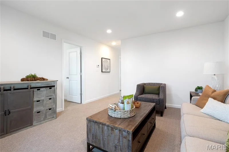 Living area with light colored carpet and recessed lighting — 0 Chesapeake @ Montage at Hawk Ridge, Lake St. Louis, MO 63367