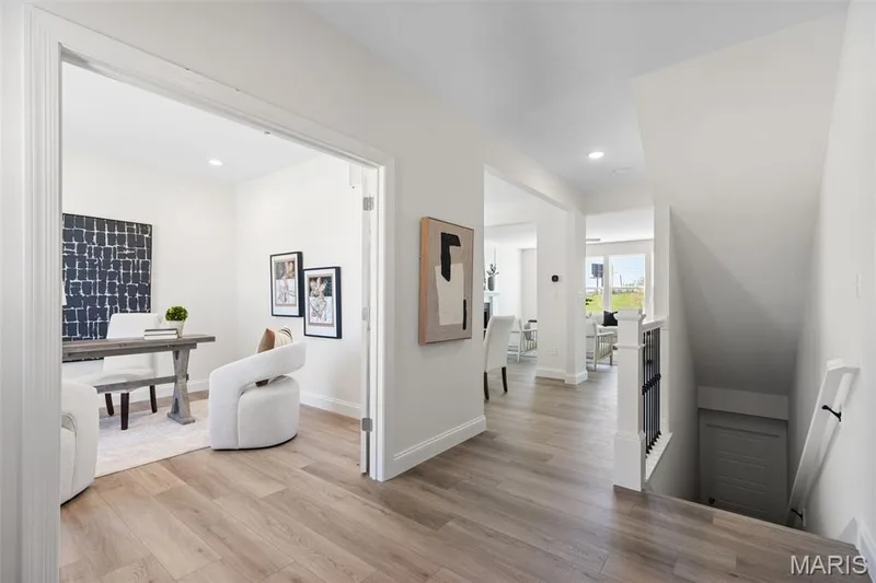 Hallway with an upstairs landing, light wood-type flooring, and recessed lighting — 0 Lancaster @ Montage at Hawk Ridge, Lake St. Louis, MO 63367