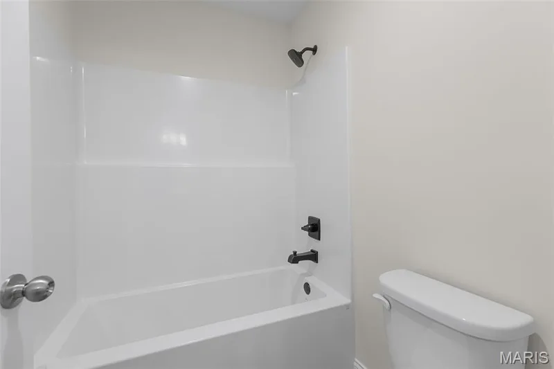 Bathroom featuring tub / shower combination and toilet — 0 Lancaster @ Montage at Hawk Ridge, Lake St. Louis, MO 63367