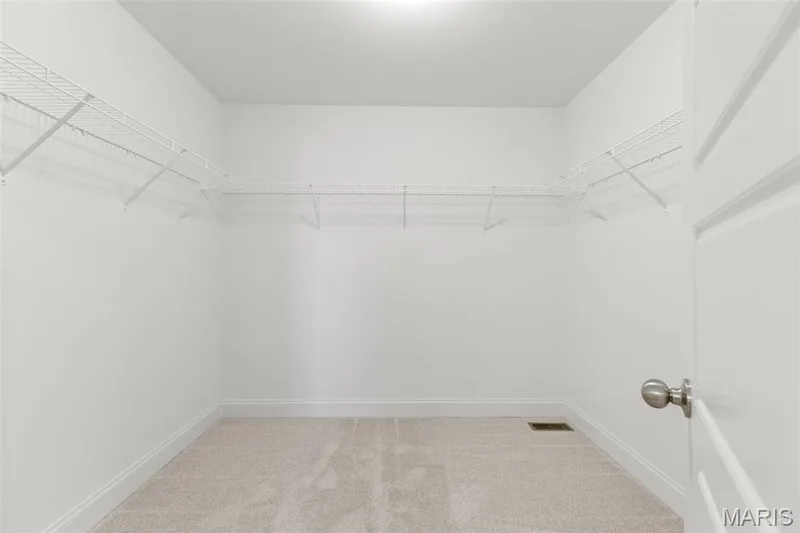 Walk in closet featuring light carpet — 0 Lancaster @ Montage at Hawk Ridge, Lake St. Louis, MO 63367