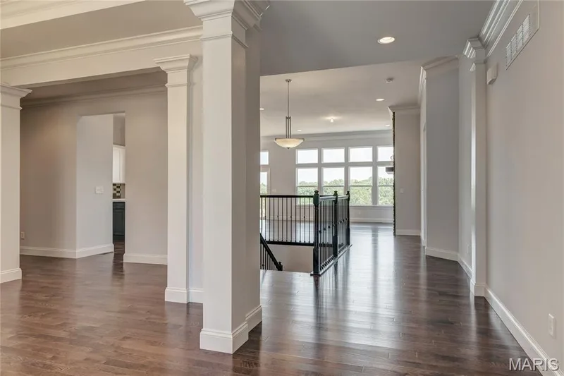 Corridor featuring an upstairs landing, dark wood-type flooring, recessed lighting, and crown molding — 0 Pierce @ Montage at Hawk Ridge, Lake St. Louis, MO 63367