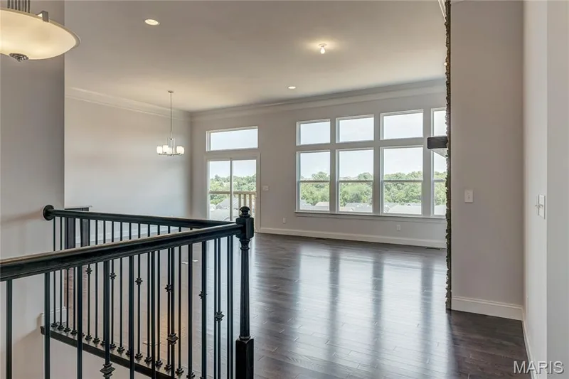 Hallway with crown molding, dark wood-style flooring, a chandelier, and recessed lighting — 0 Pierce @ Montage at Hawk Ridge, Lake St. Louis, MO 63367