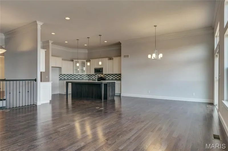 Living room featuring crown molding, dark wood-style floors, a chandelier, and recessed lighting — 0 Pierce @ Montage at Hawk Ridge, Lake St. Louis, MO 63367