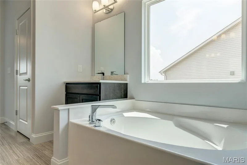 Bathroom featuring vanity and a garden tub — 0 Pierce @ Montage at Hawk Ridge, Lake St. Louis, MO 63367
