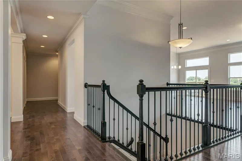 Corridor featuring crown molding, an upstairs landing, recessed lighting, and dark wood-style flooring — 0 Pierce @ Montage at Hawk Ridge, Lake St. Louis, MO 63367