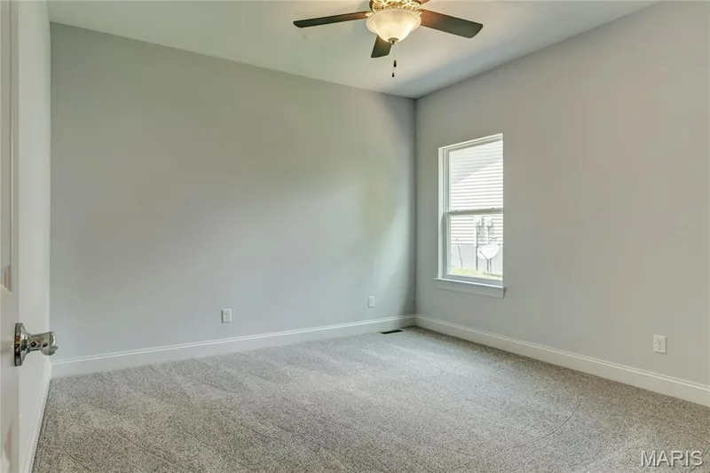 Empty room with carpet flooring and a ceiling fan — 0 Pierce @ Montage at Hawk Ridge, Lake St. Louis, MO 63367