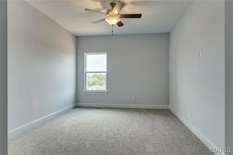 Empty room with light colored carpet and ceiling fan — 0 Pierce @ Montage at Hawk Ridge, Lake St. Louis, MO 63367