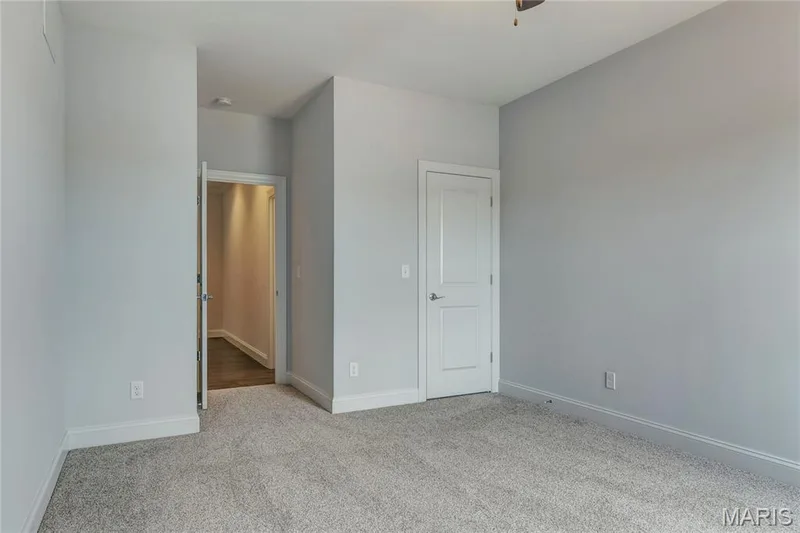 Unfurnished bedroom with light colored carpet and baseboards — 0 Pierce @ Montage at Hawk Ridge, Lake St. Louis, MO 63367