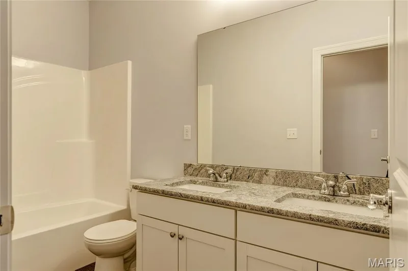 Full bath featuring double vanity and shower / bath combination — 0 Pierce @ Montage at Hawk Ridge, Lake St. Louis, MO 63367