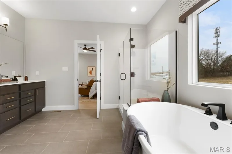 Full bathroom with vanity, a freestanding bath, a stall shower, light tile patterned floors, and recessed lighting — 0 Sierra @ Montage at Hawk Ridge, Lake St. Louis, MO 63367