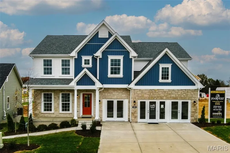 Craftsman-style house featuring a porch, stone siding, a shingled roof, and board and batten siding — 0 Windsor @ Montage at Hawk Ridge, Lake St. Louis, MO 63367