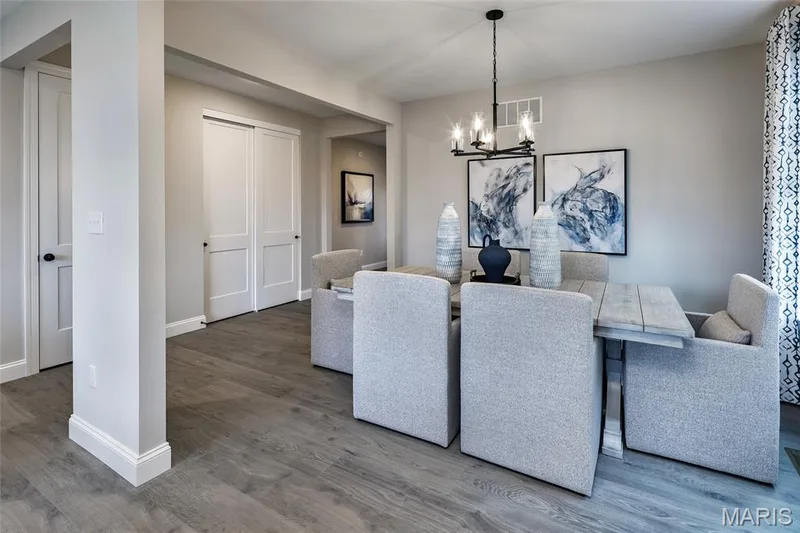 Dining room featuring wood finished floors and a chandelier — 0 Windsor @ Montage at Hawk Ridge, Lake St. Louis, MO 63367